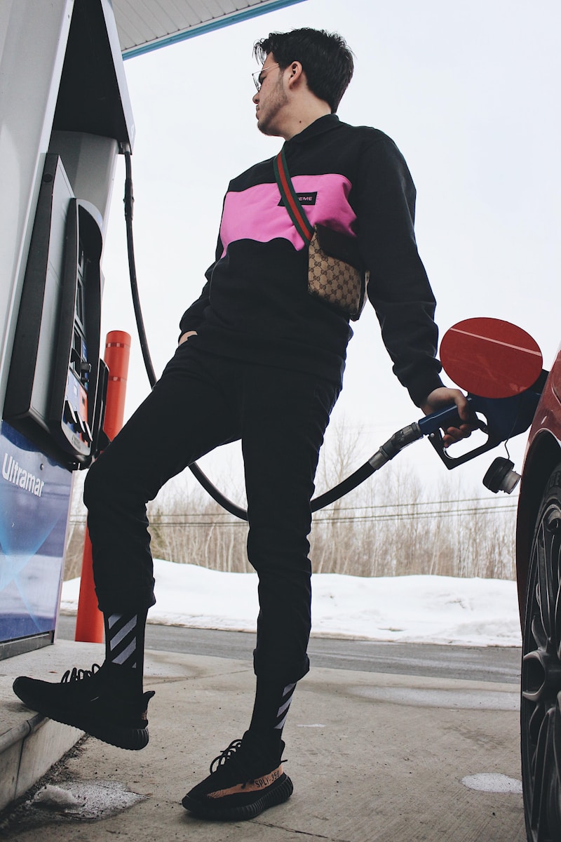 man wearing black and pink long-sleeved shirt